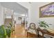 Inviting foyer showcasing hardwood floors, staircase, and elegant decor at 205 Olive Field Dr, Holly Springs, NC 27540