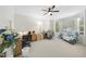 Bright office space with neutral walls, ceiling fan, and built-in shelves at 205 Olive Field Dr, Holly Springs, NC 27540