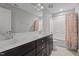 Bright bathroom with a double sink vanity, framed mirror, and a shower-tub combo at 2057 Big Falls Dr, Wendell, NC 27591