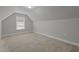 Inviting bedroom features a neutral palette, plush carpeting and a window at 2057 Big Falls Dr, Wendell, NC 27591