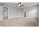 Spacious bedroom featuring neutral paint, plush carpeting, and a ceiling fan at 2057 Big Falls Dr, Wendell, NC 27591