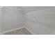Walk-in closet with wire shelving and neutral carpeting, perfect for storage solutions at 2057 Big Falls Dr, Wendell, NC 27591