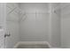 Walk-in closet with wire shelving and neutral carpeting, great for organized storage at 2057 Big Falls Dr, Wendell, NC 27591