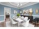 A stylish dining room showcasing modern furniture, decor and adjacent butler's pantry at 2057 Big Falls Dr, Wendell, NC 27591