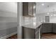 Well-equipped kitchen showing granite countertops, stainless appliances, and a convenient pantry for storage at 2057 Big Falls Dr, Wendell, NC 27591