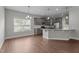 Spacious kitchen featuring a large island, stainless steel appliances, and hardwood floors for a modern touch at 2057 Big Falls Dr, Wendell, NC 27591