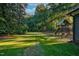 Backyard featuring a fenced playground with a swing set and slide for Gathering fun at 206 Cottrell Dr, Louisburg, NC 27549