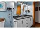 Stylish bathroom with double sink vanity, granite countertop, and modern fixtures at 206 Cottrell Dr, Louisburg, NC 27549
