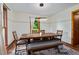 Cozy dining room with modern light fixture and seating for six at 206 Cottrell Dr, Louisburg, NC 27549