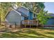 Spacious wooden deck enhances this lovely home's outdoor appeal at 206 Cottrell Dr, Louisburg, NC 27549