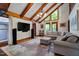 Bright living room featuring vaulted ceilings, hardwood floors, a modern TV and speaker system at 206 Cottrell Dr, Louisburg, NC 27549