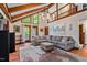 Bright living room featuring vaulted ceilings, hardwood floors, a modern TV and speaker system at 206 Cottrell Dr, Louisburg, NC 27549