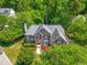 Stately two-story brick home surrounded by lush landscaping and mature trees in a lovely neighborhood at 206 Glebe Way, Cary, NC 27519