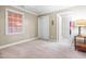 Neutral bedroom with carpet, window, and closet near entrance to another room at 206 Glebe Way, Cary, NC 27519