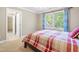 Bedroom featuring a bed, a large window with natural light, and an adjacent room at 206 Glebe Way, Cary, NC 27519