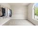 Spacious walk-in closet with shelving and a window providing natural light and outdoor views at 206 Glebe Way, Cary, NC 27519