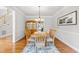 Traditional dining room featuring hardwood floors, chandelier, and decorative accents at 206 Glebe Way, Cary, NC 27519
