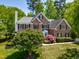 Lovely brick two-story home with manicured lawn, lush landscaping and a classic design at 206 Glebe Way, Cary, NC 27519