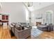 Spacious living room with fireplace, hardwood floors, and large windows for ample light at 206 Glebe Way, Cary, NC 27519