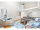 Open living room with a large sectional sofa, hardwood floors, and natural light at 206 Glebe Way, Cary, NC 27519
