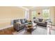 Cozy living room with hardwood floors, recessed lighting, and comfortable seating at 206 Glebe Way, Cary, NC 27519