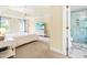 Spacious main bedroom with a ceiling fan and ensuite bathroom with glass shower at 206 Glebe Way, Cary, NC 27519