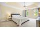 Large main bedroom with tray ceiling, ceiling fan, and ample natural light at 206 Glebe Way, Cary, NC 27519