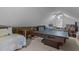 Spacious attic with a ping pong table, sleeping space, and unique architectural details at 2113 Port Royal Rd, Raleigh, NC 27609