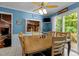 Eat-in kitchen featuring a wooden dining table and sliding doors to the outdoor deck at 2113 Port Royal Rd, Raleigh, NC 27609