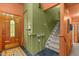 Bright entryway with unique green and orange color scheme and staircase access at 2113 Port Royal Rd, Raleigh, NC 27609