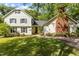 Traditional two-story home with a charming brick chimney, lush landscaping, and well-manicured front lawn at 2113 Port Royal Rd, Raleigh, NC 27609