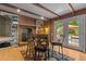Cozy game room with brick fireplace, built-in shelving, and access to the deck at 2113 Port Royal Rd, Raleigh, NC 27609