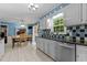 Beautiful kitchen features stainless steel appliances and dining area with outdoor views at 2113 Port Royal Rd, Raleigh, NC 27609