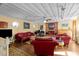 Comfortable living room featuring a cozy fireplace, plush seating, and abundant natural light at 2113 Port Royal Rd, Raleigh, NC 27609
