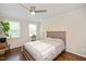 Bedroom featuring hardwood floors, neutral walls, and ample natural light at 2210 Milburnie Rd, Raleigh, NC 27610