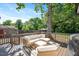 Well appointed deck featuring ample seating and overlooking the backyard space at 2210 Milburnie Rd, Raleigh, NC 27610