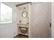 Entryway with a stylish barn door, a console table, and hardwood floors at 2210 Milburnie Rd, Raleigh, NC 27610