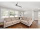 Inviting living space featuring a comfortable sectional sofa, hardwood flooring and ample natural light at 2210 Milburnie Rd, Raleigh, NC 27610