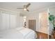Main bedroom with hardwood floors, a ceiling fan, and an ensuite bathroom at 2210 Milburnie Rd, Raleigh, NC 27610