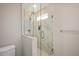 Elegant glass shower featuring marble tile and dual shower heads in remodeled bathroom at 2210 Milburnie Rd, Raleigh, NC 27610