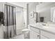 Well-lit bathroom with a single sink vanity, tub-shower, and modern fixtures at 2301 Bolingbrook Ln, Raleigh, NC 27613