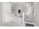 Bright bathroom featuring a large soaking tub and a glass-enclosed shower at 2301 Bolingbrook Ln, Raleigh, NC 27613