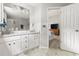 Bathroom featuring a double vanity, white cabinetry, and modern fixtures at 2301 Bolingbrook Ln, Raleigh, NC 27613