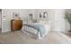 Bright bedroom featuring a comfortable bed, stylish dresser, and ensuite bathroom at 2301 Bolingbrook Ln, Raleigh, NC 27613