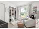 Charming Bedroom with a comfy chair, a large window, and organized closet at 2301 Bolingbrook Ln, Raleigh, NC 27613