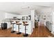 Stylish kitchen with white cabinets, granite countertops, breakfast bar, and sleek appliances, perfect for cooking and entertaining at 2301 Bolingbrook Ln, Raleigh, NC 27613