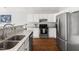 Bright kitchen features granite counters, stainless appliances, and a spacious double sink at 2301 Bolingbrook Ln, Raleigh, NC 27613