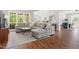 Comfortable living room featuring a large sectional sofa, area rug, and abundant natural light for a cozy atmosphere at 2301 Bolingbrook Ln, Raleigh, NC 27613