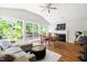 Spacious living area with fireplace, vaulted ceilings, and large windows offer natural light at 2301 Bolingbrook Ln, Raleigh, NC 27613