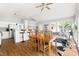 Open living and dining area with vaulted ceilings and view to modern kitchen at 2301 Bolingbrook Ln, Raleigh, NC 27613